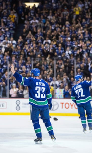 Sedin twins combine on OT winner in their final home game